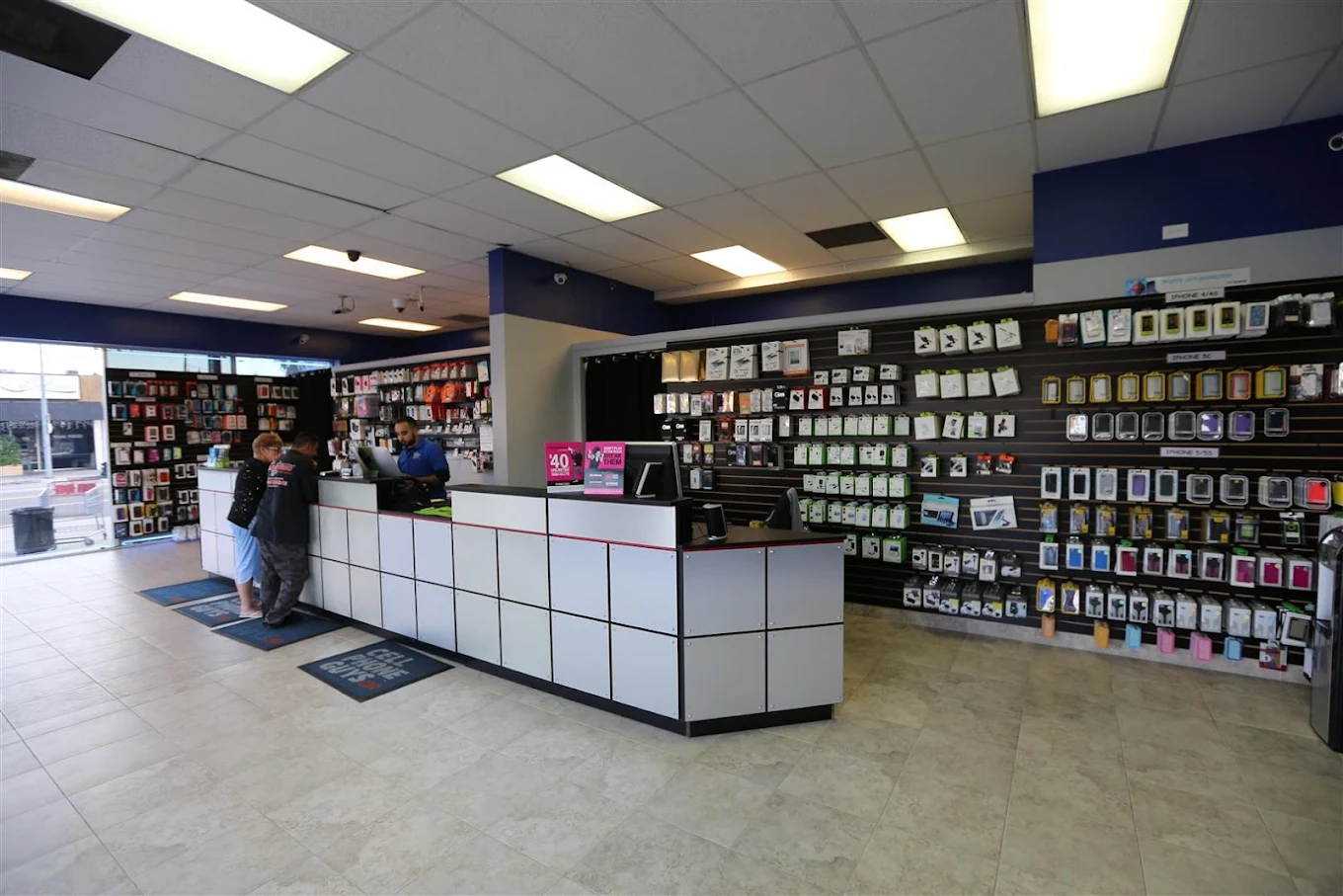 Inside Cellphone Guys: repair counter and accessories wall